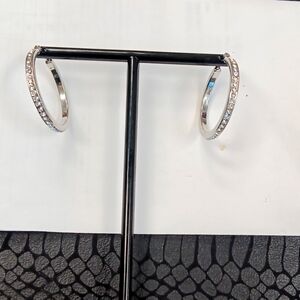 Round earrings with stones in them.Prices pay for groceries and even to start in